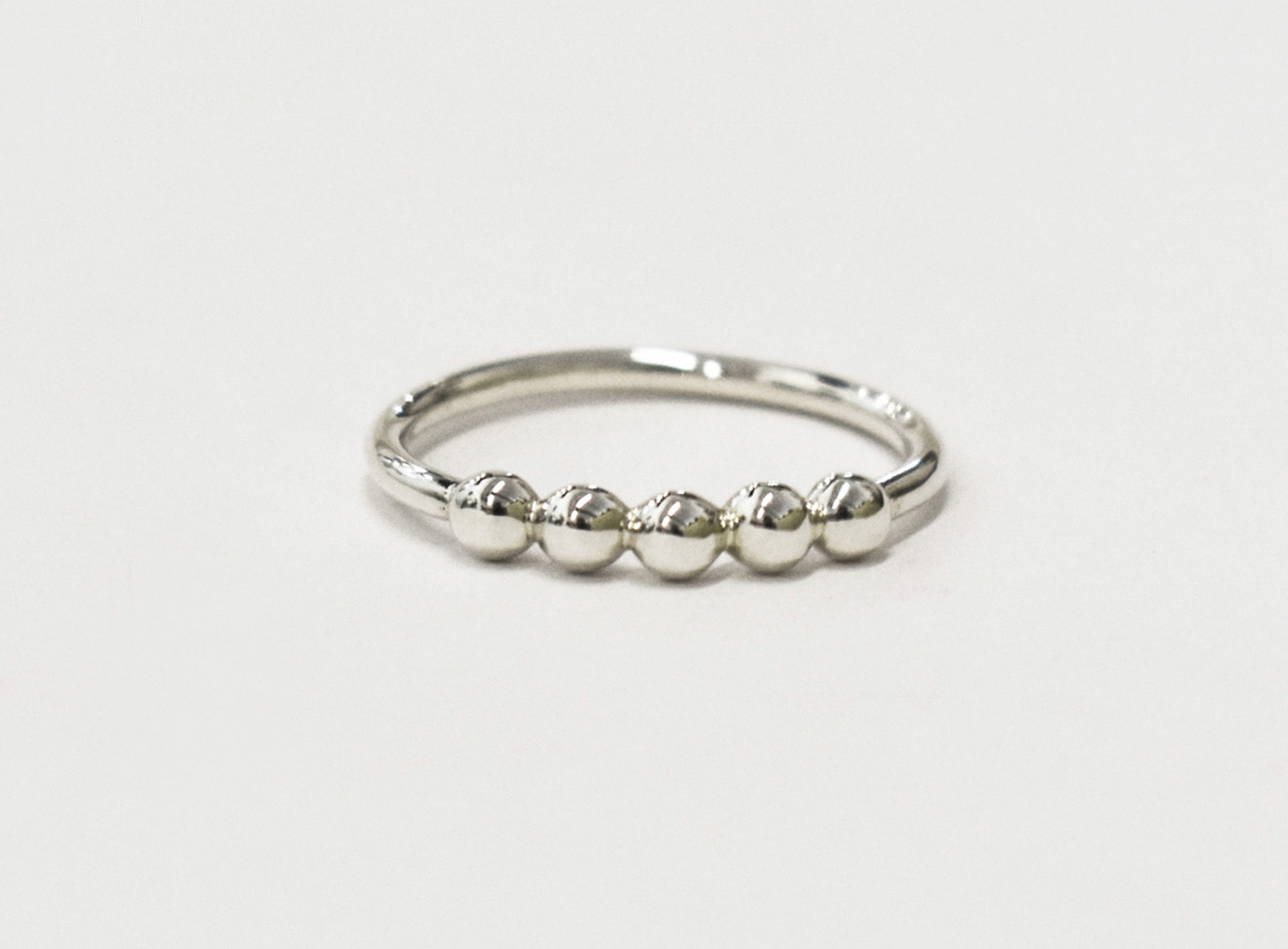 five-pebble-ring-a-sterling-silver-stacking-ring-inspired-by-smooth